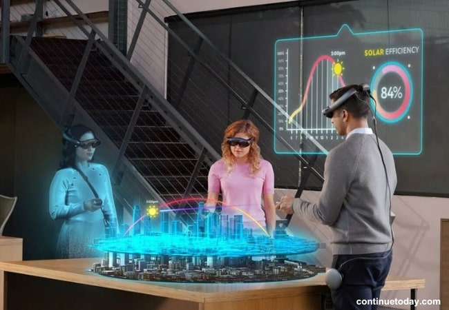 one male and two female using Mixed Reality for project work
